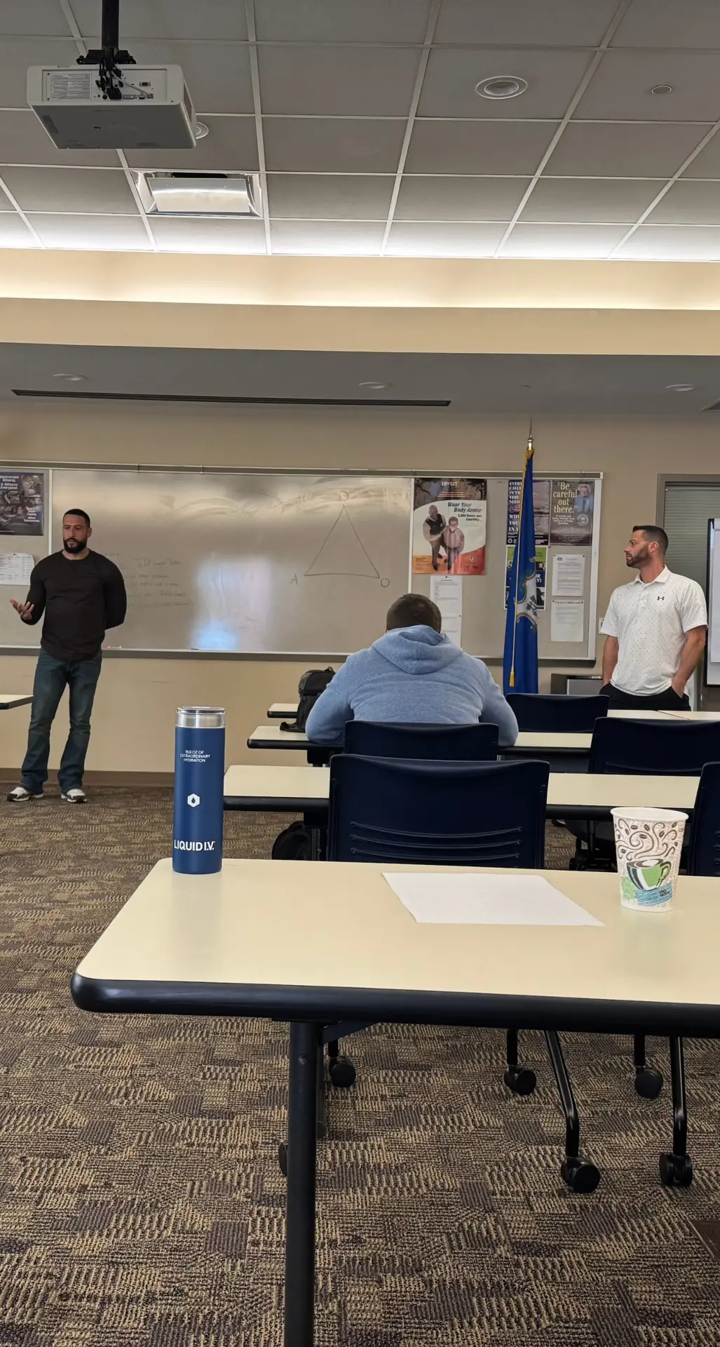 In-person workplace violence prevention training session with instructors and participants in a classroom setting